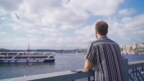 Model-young-man-by-the-sea-in-Istanbul.